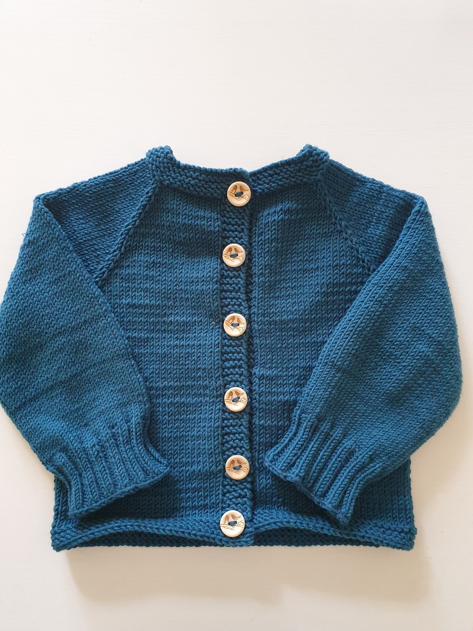 Bērnu jakas apraksts (reglāns no augšas) (izmēros jaundzimušo - 5 gadi)